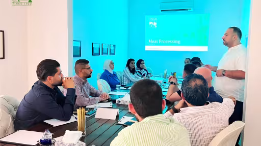 Finan team members attending a technical and business training session