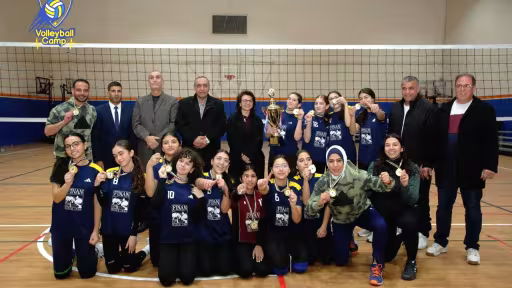 Wadi Finan Club volleyball team with the 2025 championship trophy