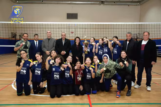 Wadi Finan Club volleyball team with the 2025 championship trophy