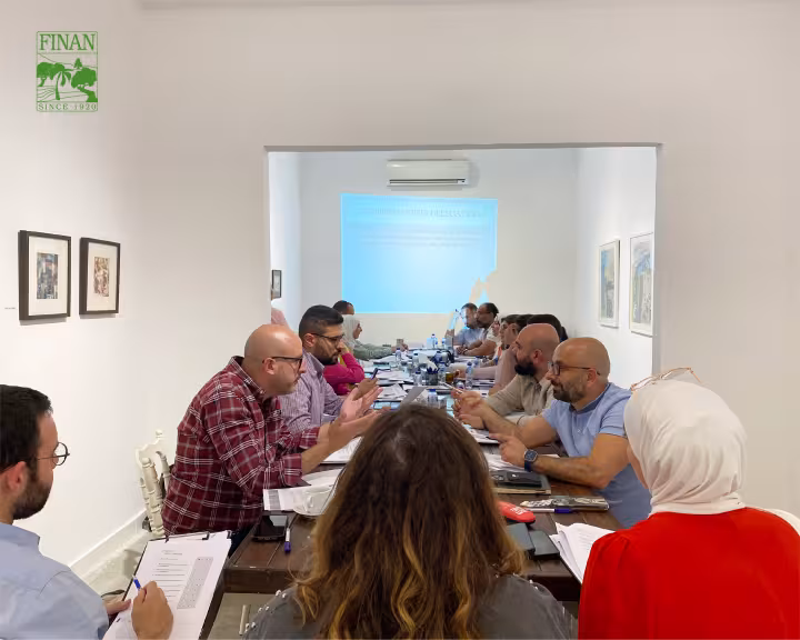 Finan team members in discussion during the technical and business training