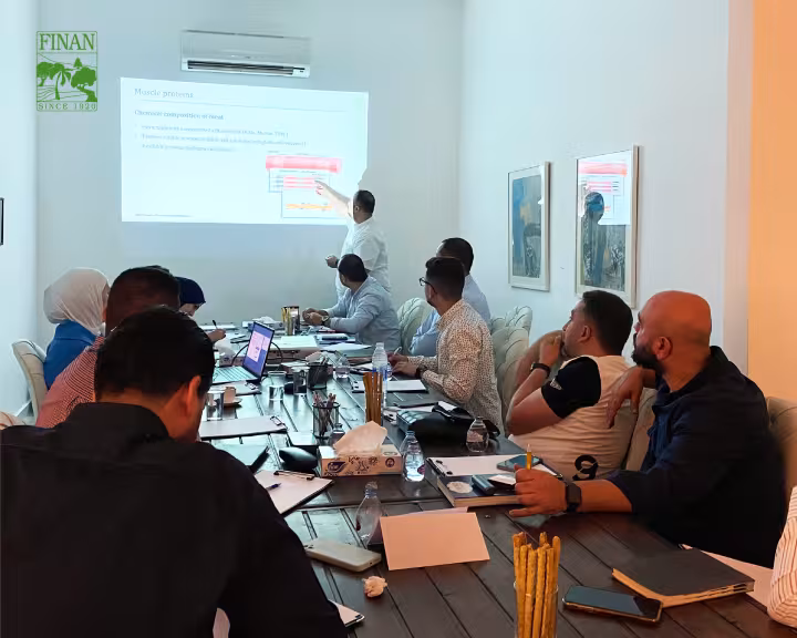 Presenter explaining a slide during the technical and business training