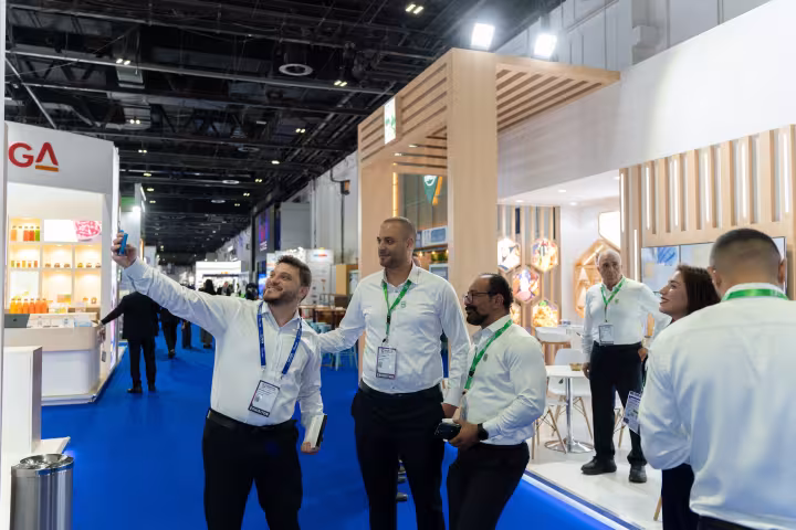Finan Group team members taking a selfie at the stand, Gulfood Manufacturing 2024