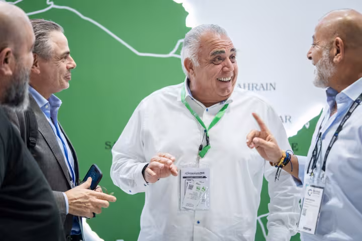 Finan Group representative in conversation with visitors, Gulfood Manufacturing 2025